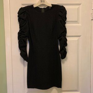 Wool black mini dress with scrunched ruffled sleeves and full length zip